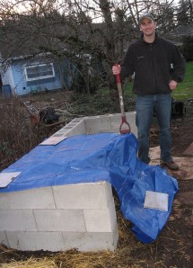 craig with compost pile and pitch fork